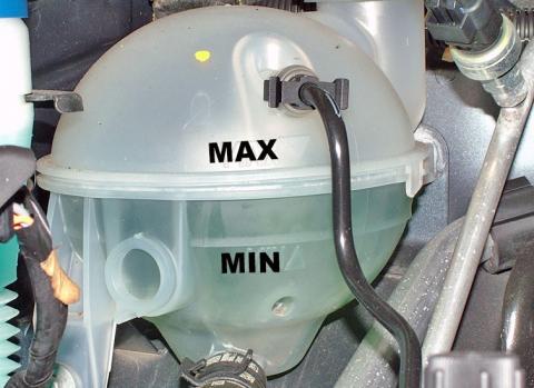 The coolant tank has MAX and MIN levels marked Coolant tank MAX and MIN level marks