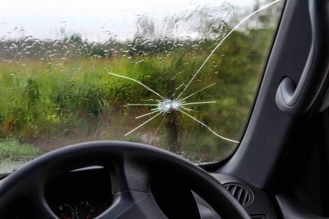 A windscreen chip can quickly grow A chip on a car windscreen