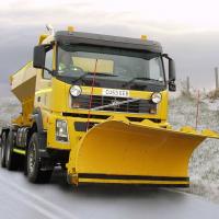 A road gritter on an icy road